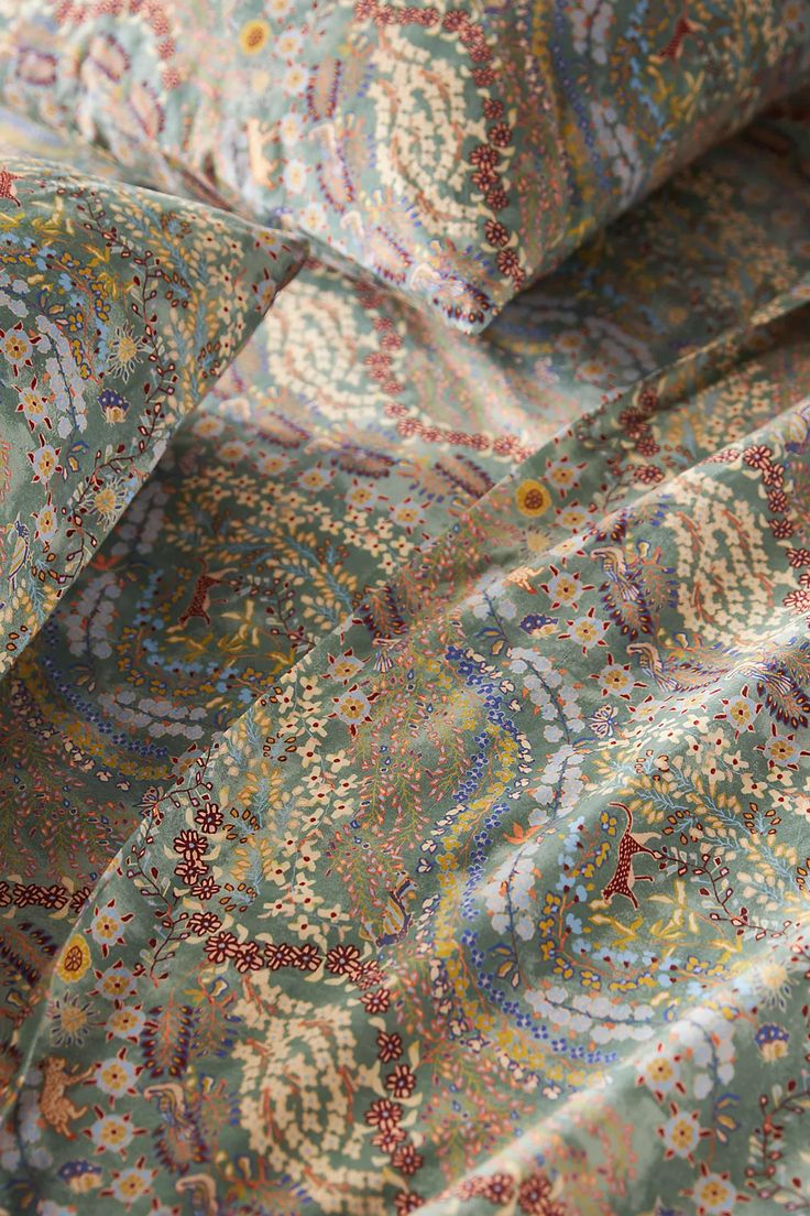 the fabric is very colorful and has an intricate design on it's side,