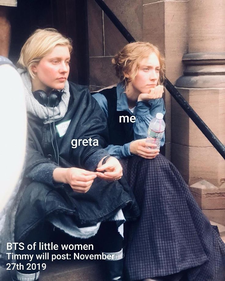 two women sitting on the steps with headphones