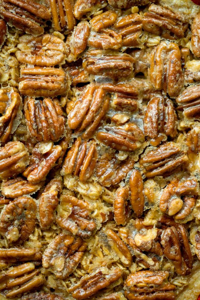 an overhead view of pecans in a casserole dish