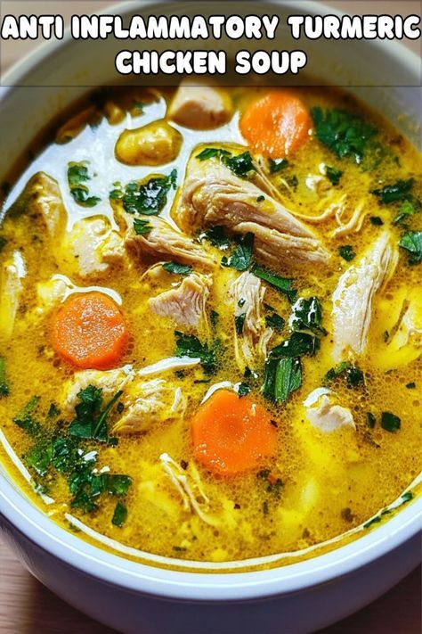 a white bowl filled with chicken soup on top of a wooden table