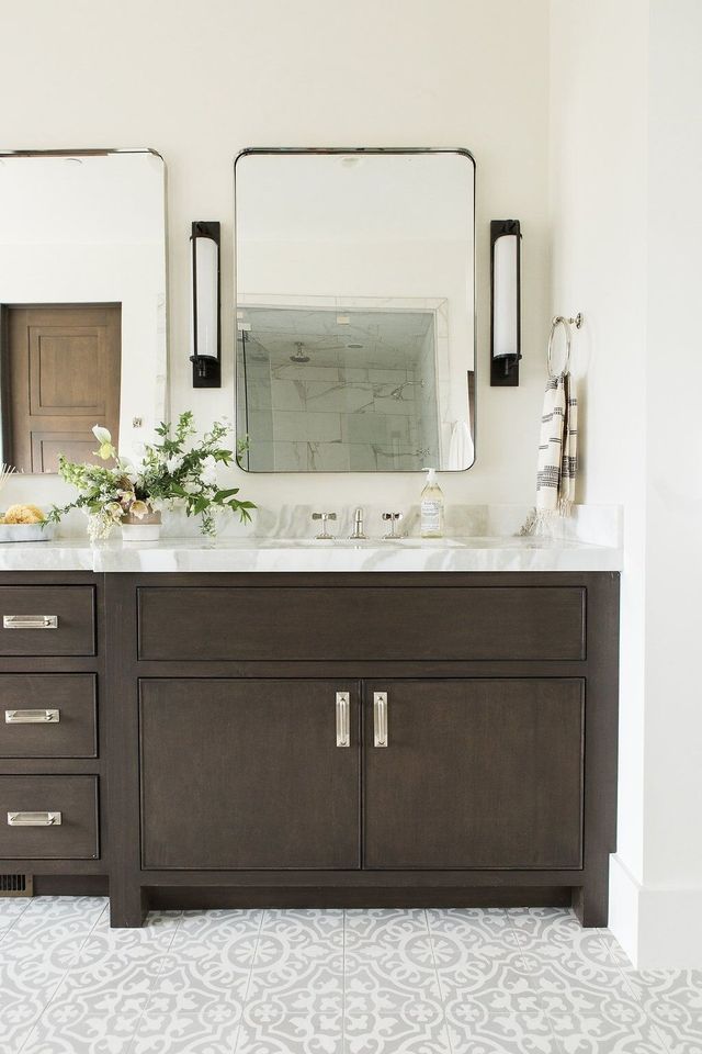 a bathroom vanity with two sinks and a large mirror on the wall above it that says instagram