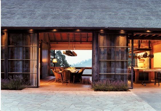 an outdoor dining area is lit up at night