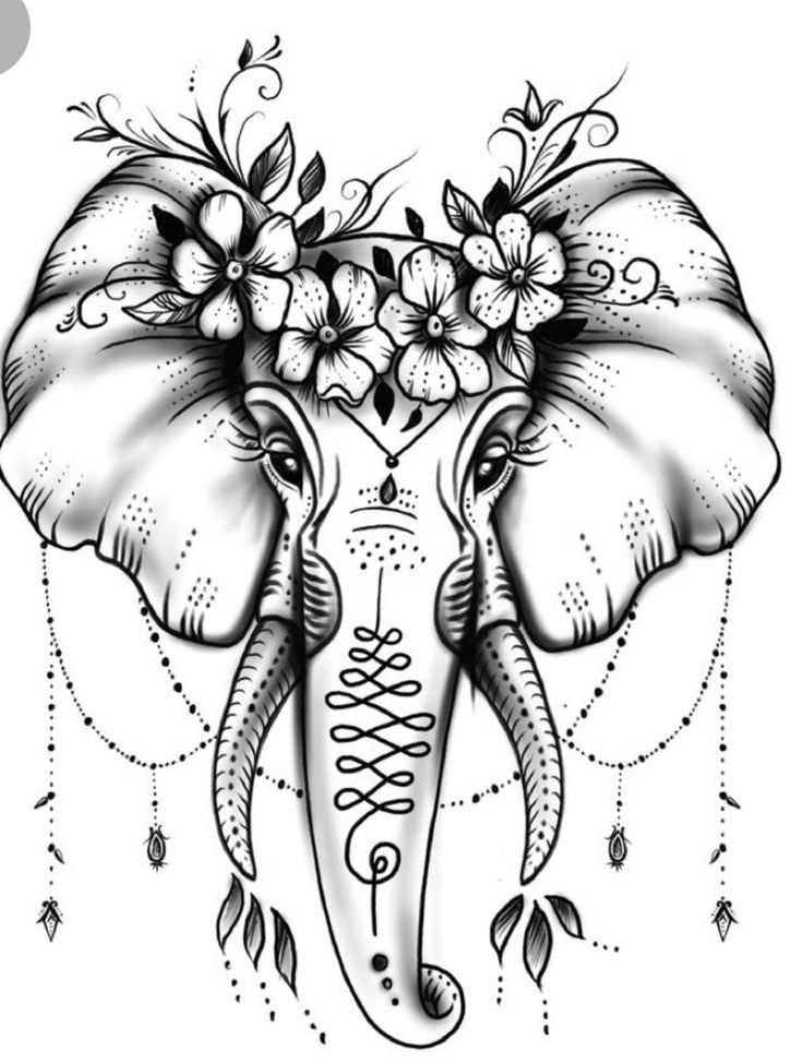 an elephant with flowers on it's tusks is shown in black and white