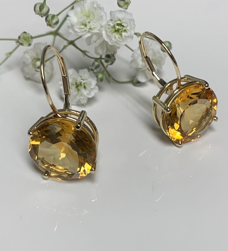 I love these earrings for being so elegant. They will be the best complement for every occasion. and the best gift for that special person. Metal 14k yellow gold Citrine3.25 Ct ( each Stone) Total weight6.50CT Custom made earrings Available in 14k white gold too 14k Gold Round Earrings, Yellow 14k Gold Fine Jewelry Earrings, Elegant Citrine Round Stone Jewelry, Elegant Round Citrine Stone Jewelry, Hallmarked 14k Gold Round Earrings, Luxury Yellow Gold Citrine Earrings, Luxury Gold Faceted Earrings, Formal 14k Gold Round Earrings, Gold Gemstone Earrings For Formal Occasions