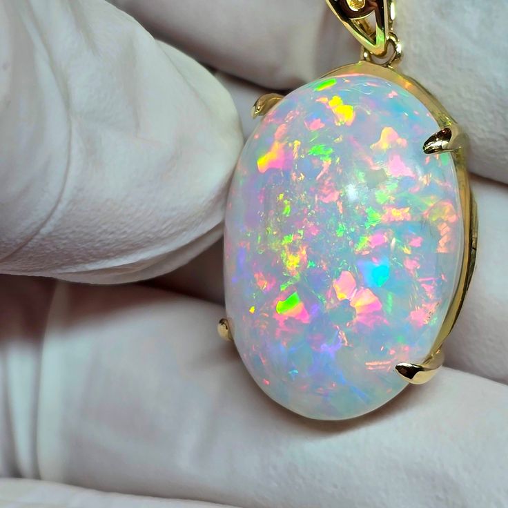 Big pink  white opal  18x25mm   20ct. Pretty pastel flecks of 3D color in a pink cloud of stone, mounted on a very simple low profile 14k solid gold pendant setting with a nice simple shiny bail. Two spots of the stone it was cut out of are hidden and not seen while wearing. 14k Gold Necklace, Pink Clouds, Pink Opal, Opal Necklace, White Opal, Opal Jewelry, Pendant Set, Gold Pendant, Solid Gold