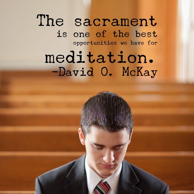 a man in a suit and tie looking down at his cell phone with a quote above him