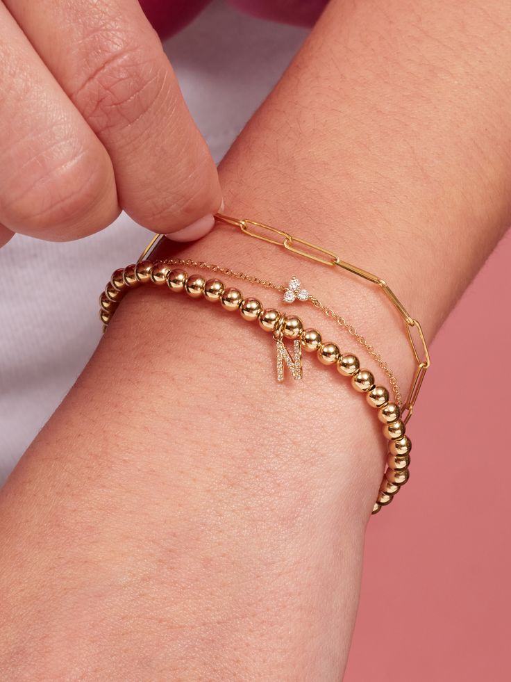 We can’t get enough of the paperclip trend! Our extra-small link style introduces a dainty new chain to your collection, and is part of our fine Paperclip Collection made of 14K gold. Mix and match with different sizes and pieces from the collection for especially on-trend stack. Dainty 14k Gold Chain Bracelet With Solid Links, Dainty Gold Plated Cable Chain Bracelet, 14k Gold Dainty Chain Bracelet With Solid Links, Dainty Gold Plated Chain Bracelet With Cable Chain, Gold Diamond Bracelet With Cable Chain, Dainty 14k Gold Filled Paperclip Bracelet With Delicate Chain, Dainty Paperclip Bracelet With Delicate Chain In 14k Gold, Yellow Gold Paperclip Bracelet With Delicate Chain, Minimalist Gold Plated Paperclip Bracelet With Solid Links