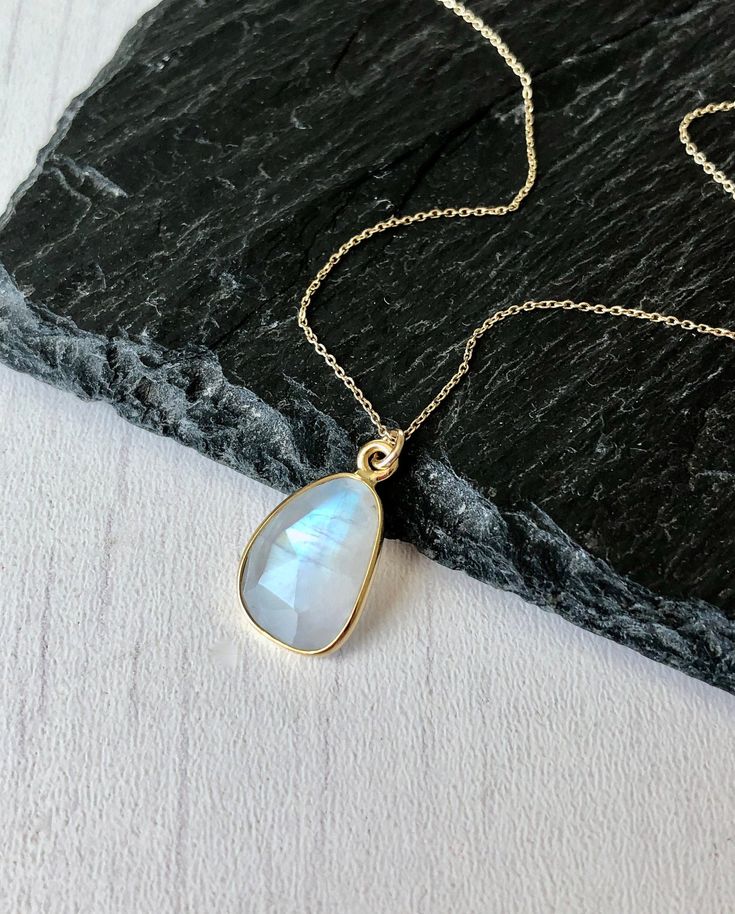 Rainbow Moonstone Necklace, Solid 14k Gold Pendant, June Birthstone, Real Gold Moonstone Jewelry , Birthday gift for her, Mother's Day Gift This classic minimalist necklace features a beautiful flashy rainbow moonstone free form pendant bezeled in solid 14k gold. The moonstone pendant is suspended from a dainty solid 14k gold cable chain that can adjust to three popular lengths, 16, 17 or 18 inches, whenever you needed. This is a slightly larger version of one of our best sellers for those that Teardrop Birthstone Gemstones For Gifts, Gold Moonstone Necklaces For Anniversary, Gold Moonstone Necklace For Anniversary, Gold Moonstone Necklace As Gift, Gold Moonstone Necklace For Gift, Yellow Gold Moonstone Jewelry With Birthstone, Teardrop Necklace With Moon Charm As Gift, Moonstone Gemstone Jewelry As A Gift, Teardrop Moon Charm Necklace As Gift