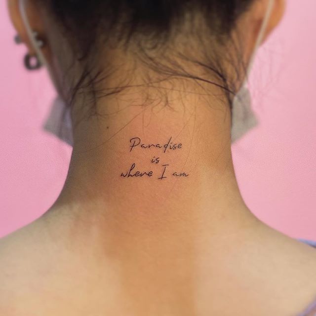 a woman's back neck with the words pompfee is where i am written on it