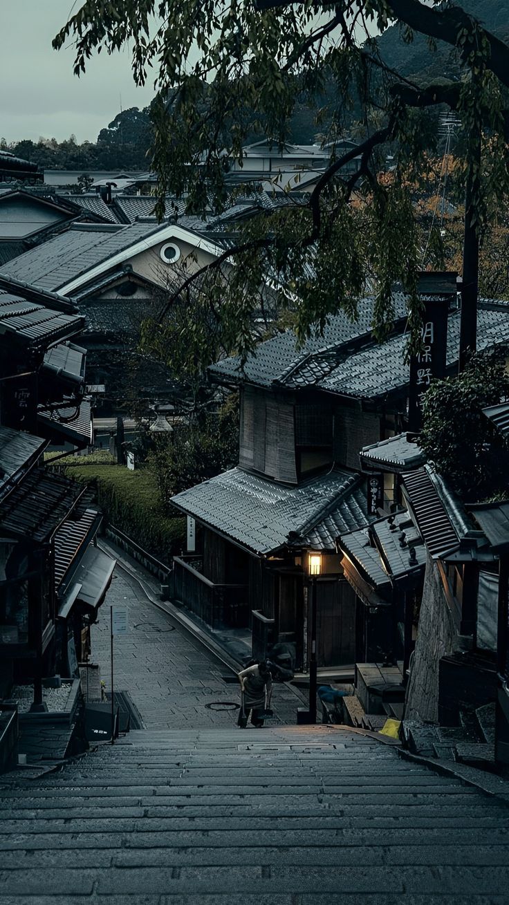 the stairs lead up to an old village