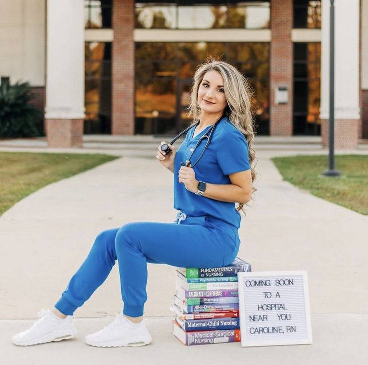 a woman sitting on top of a stack of books with a stethoscope