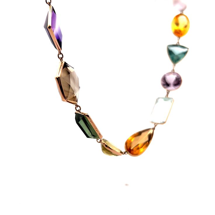 This exquisite modern necklace is crafted from 14 karat yellow gold, creating a luxurious and elegant piece that is sure to spark a conversation. The long piece features a series of multi-gemstone bezel set stones, with a total of 91.52 carats of citrine, 89.96 carats of aquamarine, 80.66 carats of quartz, 79.55 carats of amethyst, 41.31 carats of tourmaline, and 10.20 carats of topaz. The perfect combination of modern design and luxurious gemstones, this necklace is sure to delight the wearer f Multi Gemstone Necklace, Modern Necklace, Metal Shop, Modern Necklaces, Yellow Gold Pendants, Shop Engagement Rings, Gemstone Necklace, Shop Necklaces, Shop Earrings