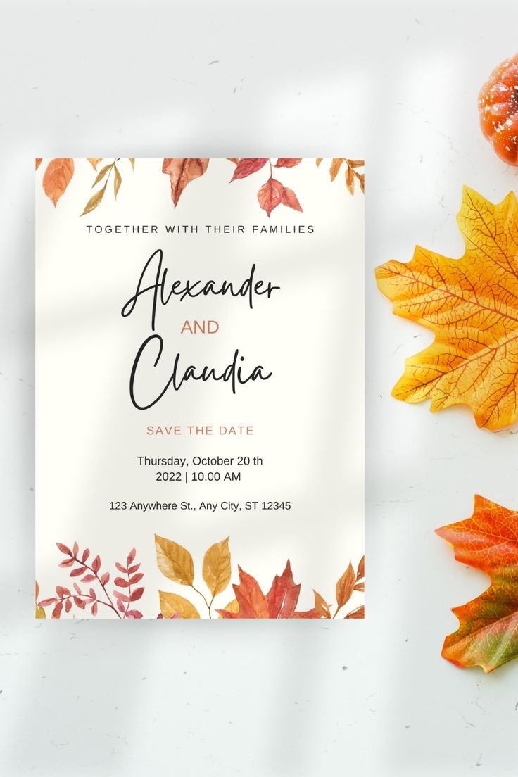 an autumn wedding save the date card with leaves