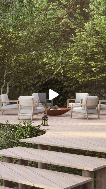 a wooden deck surrounded by chairs and trees