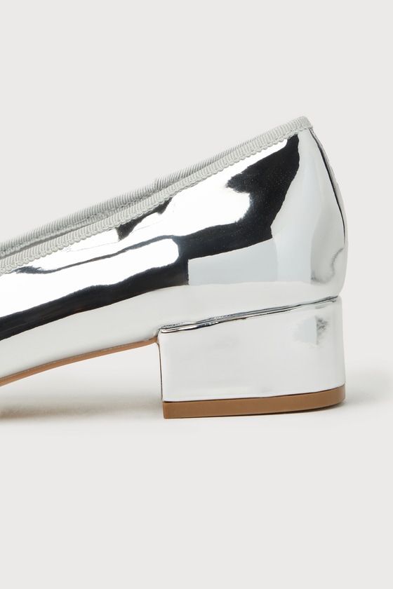 Making your look even more remarkable is easy with the Steve Madden Cherish Silver Patent Bow Low Heel Pumps! Shiny faux patent leather shapes these mesmerizing heels that feature a round toe, adorned with a dainty bow detail. A low block heel completes the trendy ballet pump design! 1. 5" block heel. Lightly cushioned insole. Rubber sole has nonskid markings. Man made materials. Imported. Lulus | Cherish Silver Patent Bow Low Heel Pumps | Size 7.5. Spring Metallic Low Heel Shoes, Metallic Heels With Stacked Heel, Pointed Toe Patent Leather Block Heels For Party, Party Patent Leather Block Heels With Pointed Toe, Metallic Patent Leather Heels For Spring, Modern Metallic Block Heel Shoes, Silver Block Heels With Padded Heel And Round Toe, Silver Block Heels With Stacked Heel And Round Toe, Silver Block Heel Court Shoes For Spring