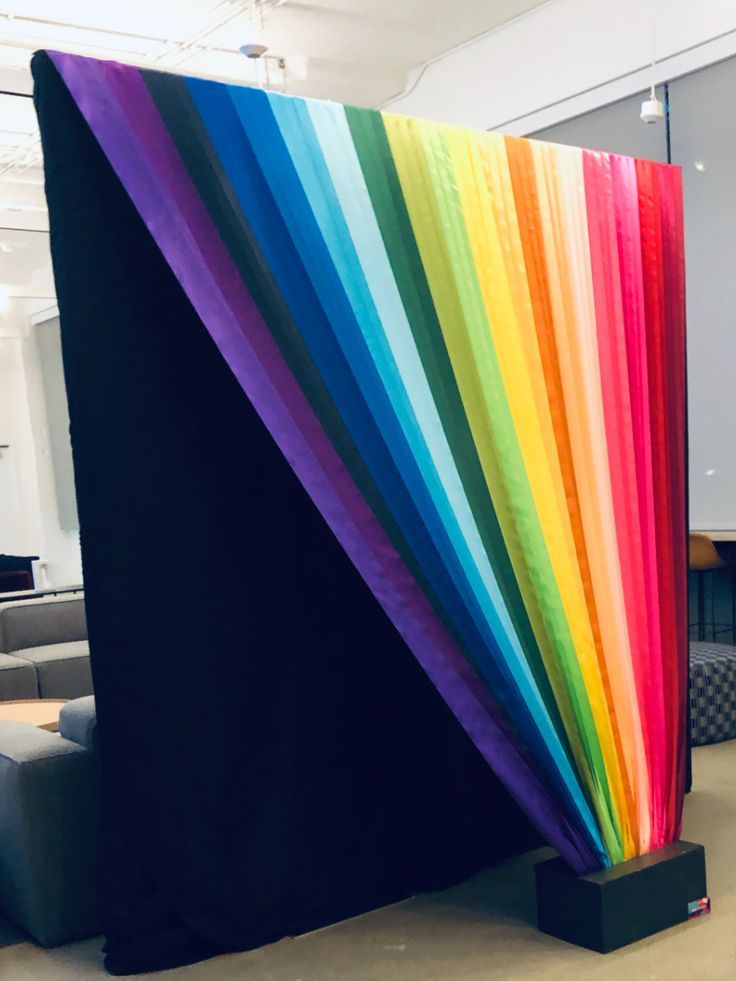 a rainbow colored curtain in an office lobby