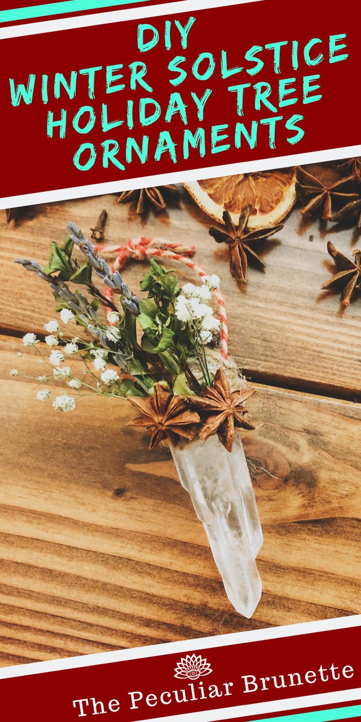 an advertisement for the winter solstice holiday tree ornament, featuring flowers and pine cones