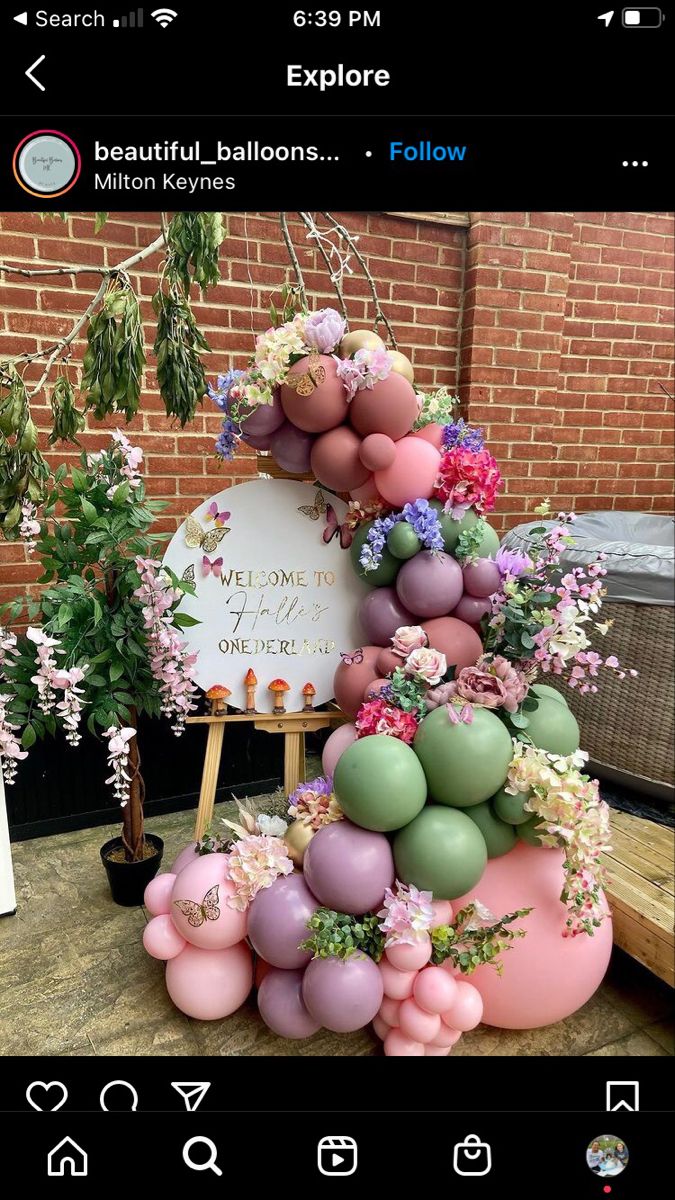 a cake made out of balloons and flowers