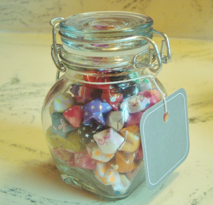 a glass jar filled with lots of colorful candies