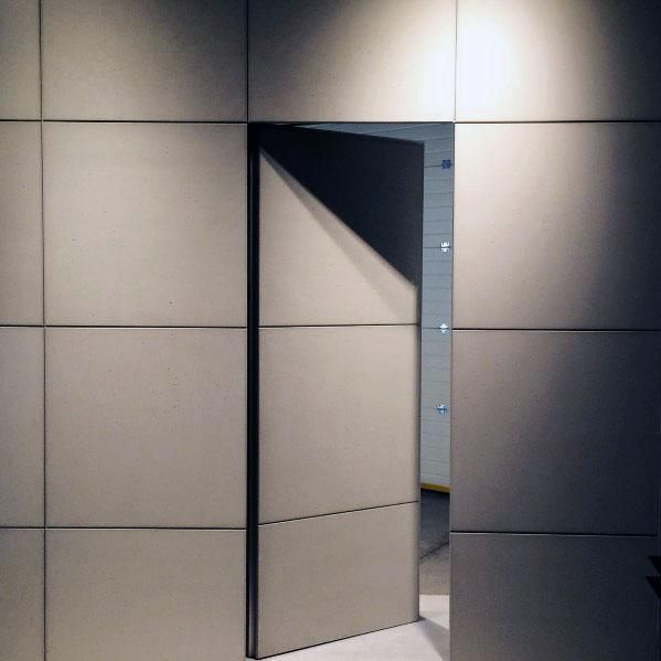 an open door is shown in the middle of a room with white tiles on the walls