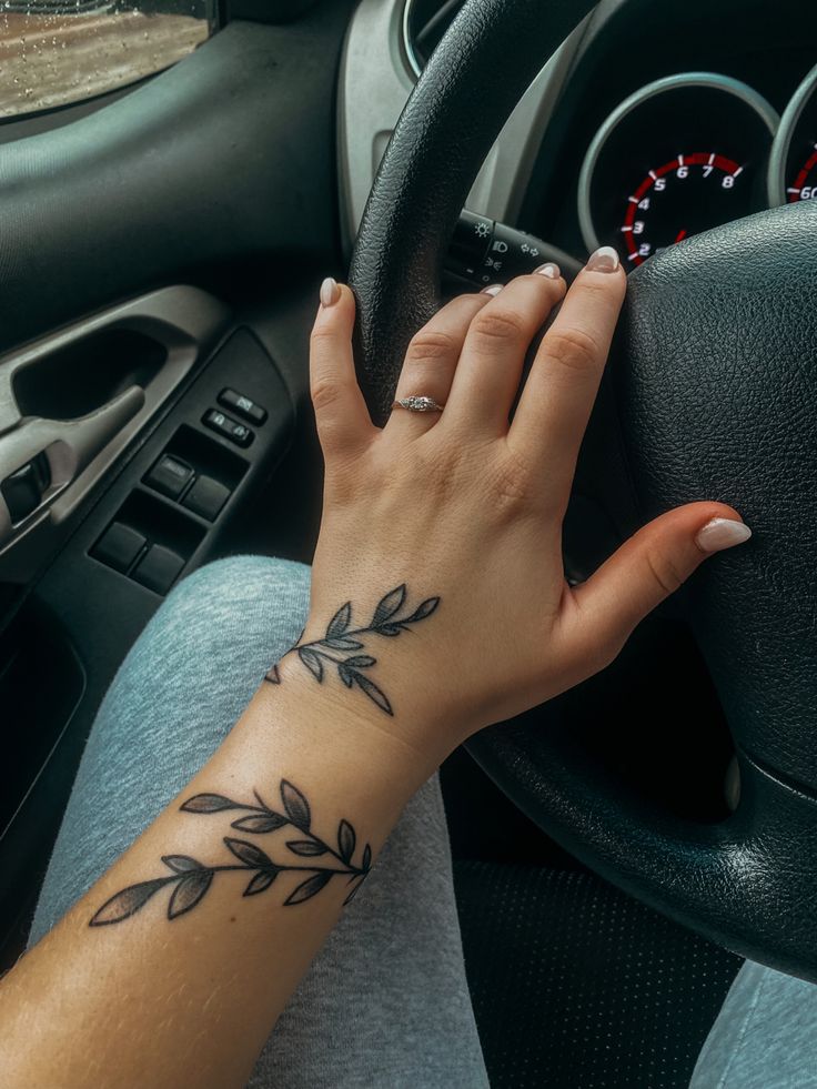 Female arm, acrylic nails, promise ring, aesthetic, modeling, tattoo, vine, floral, pretty, moody Wrist Tattoos Meaningful, Wrist Hand Tattoo, Arm Wrap Tattoo, Wrap Around Wrist Tattoos, Wrist Tattoo Cover Up, Meaningful Wrist Tattoos, Wrap Around Tattoo, Around Arm Tattoo, Wrist Tattoo Designs