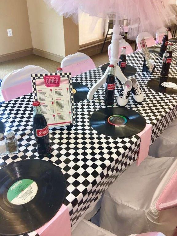 there is a table set up with vinyl records on it