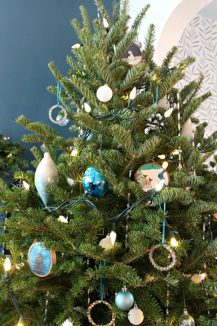 a small christmas tree with ornaments on it