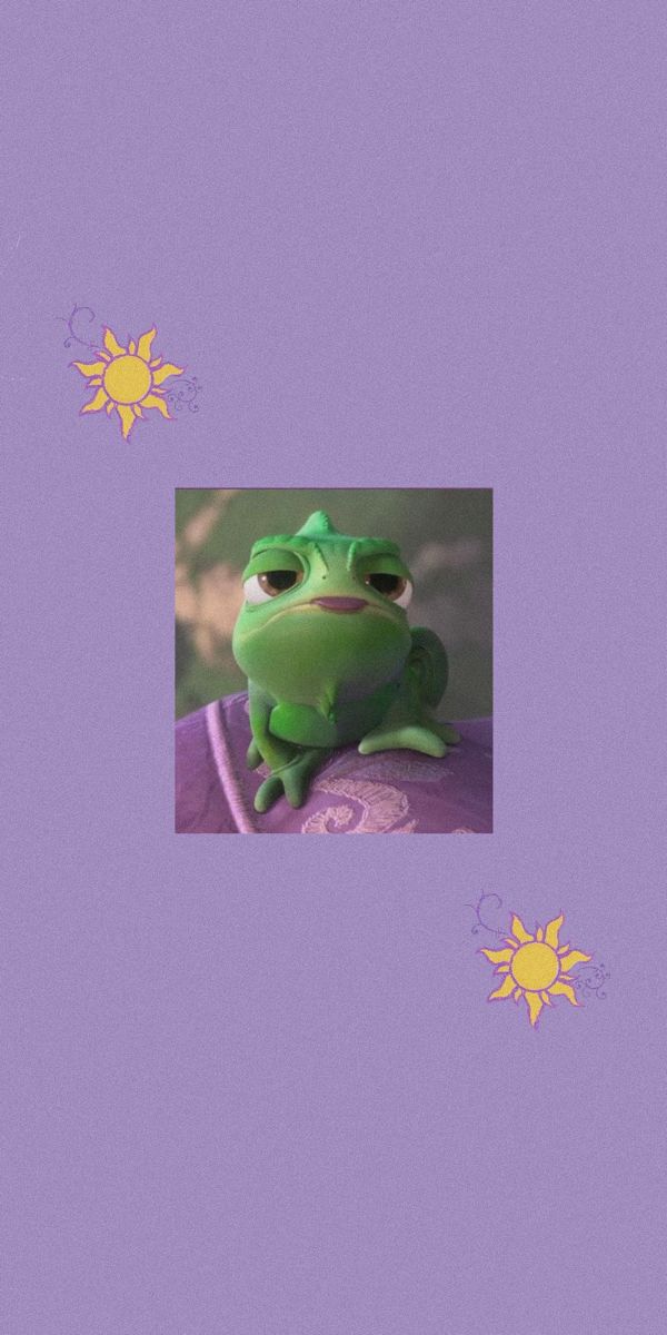 a green frog sitting on top of a purple surface with sunflowers in the background