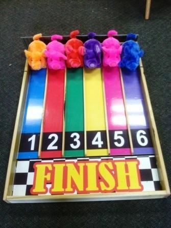 a bunch of different colored ribbons on top of each other in front of a sign that says finish