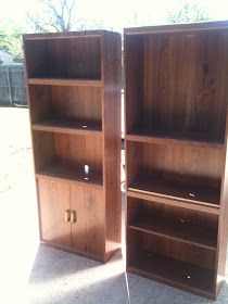 two wooden bookshelves sitting next to each other