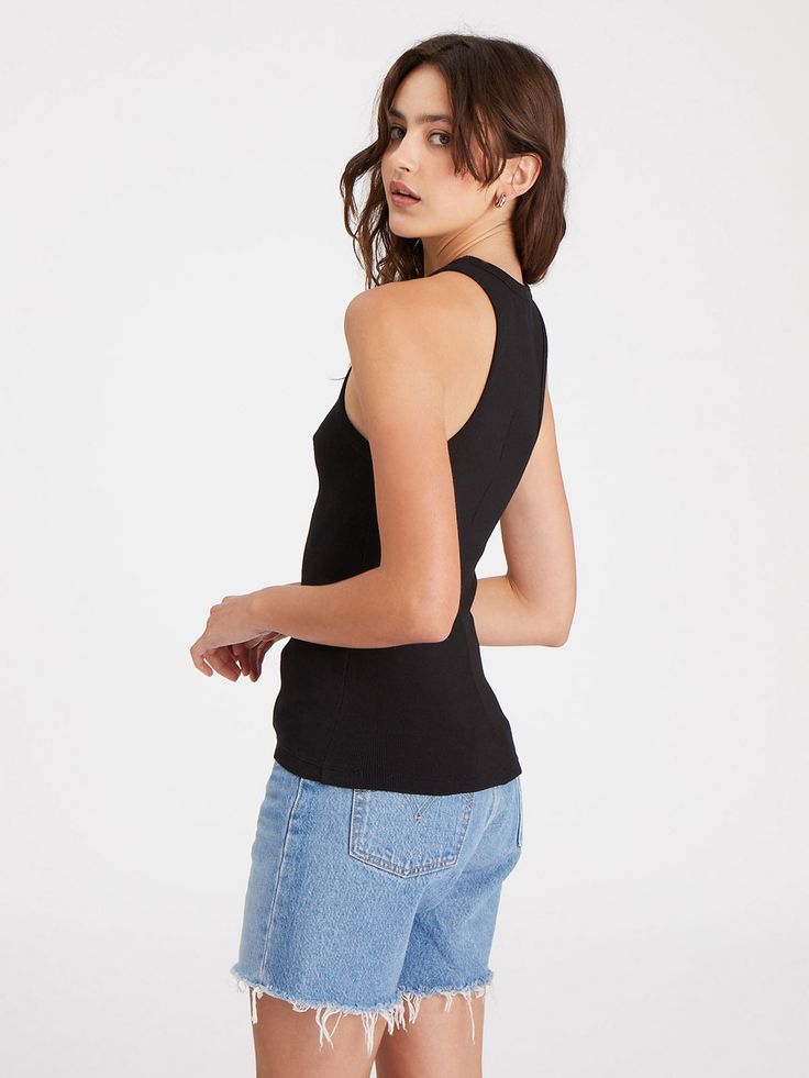 Details Pull-On Halter Neck Sleeveless Ribbed Tank Size + Fit Model is 5'9 wearing size S Front: 23 1/2 inches Back: 24 1/2 inches Fabric + Care Fabric Content: 96% Organic Cotton 4% Spandex Care: Machine Wash Cold, Lay Flat to Dry Import