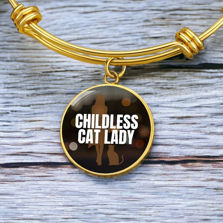 Get our Childless Cat Lady Bracelet today and be amazed by its quality and style! Made with durable surgical steel and the option for 18k gold finish, this jewelry item is the ultimate keepsake for yourself or your loved ones. Plus, we offer a 100% Happiness Guarantee - if for any reason you're not completely satisfied, just let us know and we'll make it right. Your satisfaction is our top priority. Product Dimensions➜ Luxury Bangle: 7-9" (18-22.75cm). This bangle features a stretchable design that allows it to expand as you slide it onto your wrist, then it effortlessly returns to its original shape.➜ Circle Pendant: 23.5mm x 23.5mm. Gold Stainless Steel Jewelry For Best Friend Gift, Stainless Steel Round Pendant Jewelry For Best Friend, Gold Stainless Steel Jewelry For Best Friend, Stainless Steel Bracelet Jewelry As Best Friend Gift, Stainless Steel Bracelet Jewelry For Best Friend, Round Metal Charm Bracelet Gift, Stainless Steel Bracelet For Best Friend, Gold Metal Bracelets For Best Friend Gift, Stainless Steel Bracelet For Birthday Gift