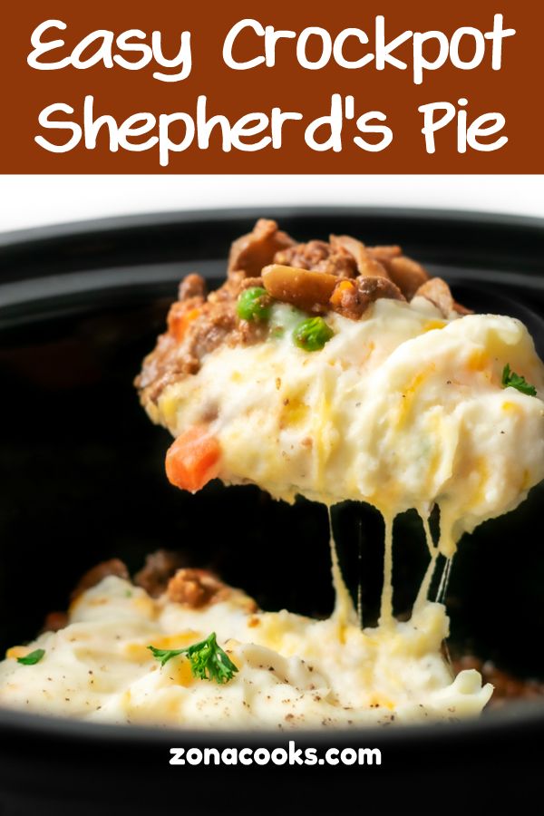 the crockpot shepherd's pie is being held up by a fork with cheese and vegetables