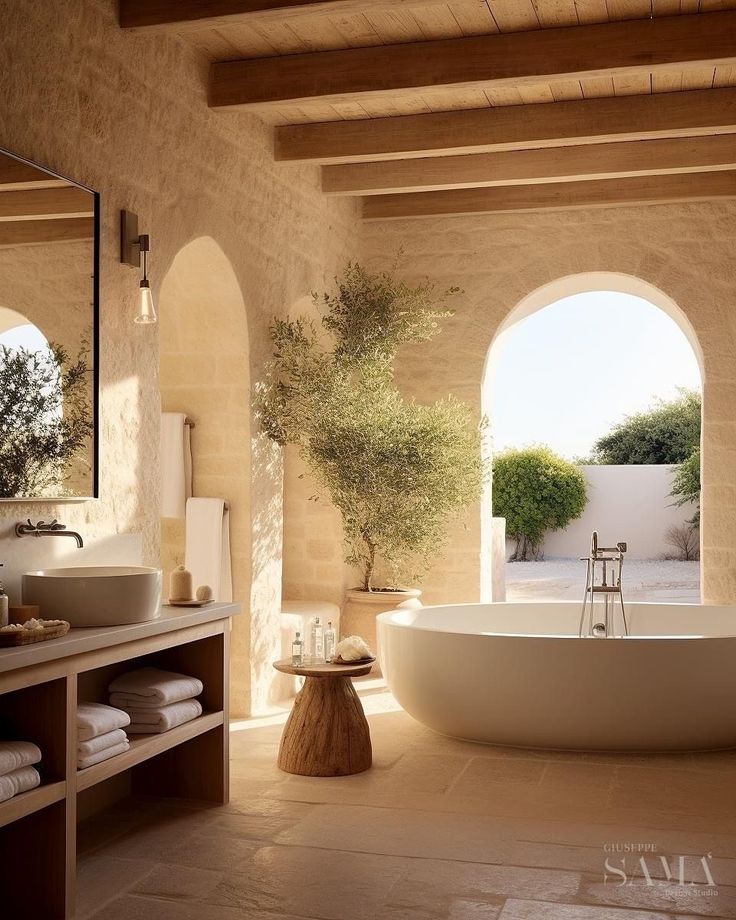 a bath room with a large tub and a sink