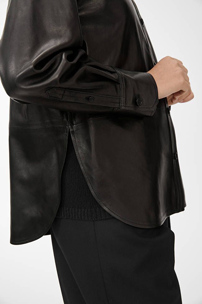 Leather Shirt - Black - Shirts & blouses - ARKET WW Timeless Spread Collar Shirt For Fall, Sleek Collared Shirt With Button Cuffs, Sleek Button-up Shirt With Concealed Placket, Classic Leather Jacket With Lapel Collar And Concealed Placket, Timeless Collared Shirt For Fall, Timeless Button-up Tops With Concealed Placket, Luxury Button-up Shirt With Hidden Closure, Luxury Shirt With Hidden Button Closure, Luxury Button-up Shirt With Hidden Buttons