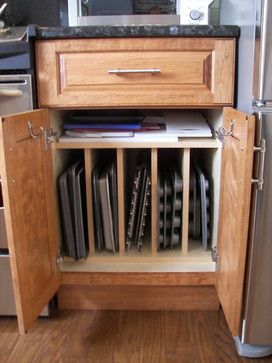 an open cabinet in the middle of a kitchen