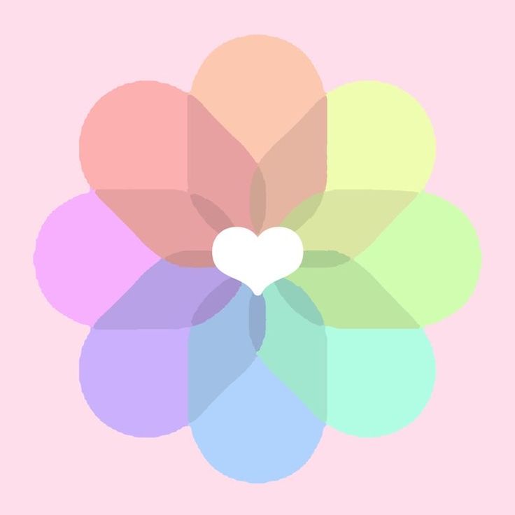 a flower with a white heart on it's center surrounded by multicolored petals