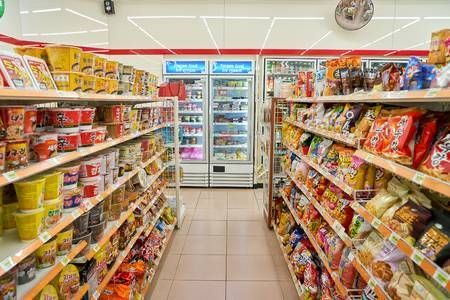 an aisle in a grocery store filled with lots of food