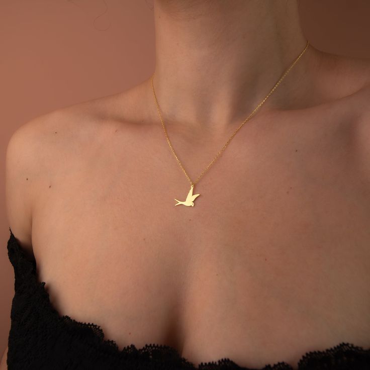 "Modern and elegant 14K gold dove necklace for everyday wear. Great for stacking with other pendants to express yourself even better.  Wonderful and unique gift idea to show your love to important people in your life with a cute and dainty gift. This dove necklace makes a perfect gift for mothers, friends or yourself. Also a special anniversary gift for significant others. ♥ All our jewelry is custom made with Love and Care in our workshop.  ✿Unless \"Solid Gold\" option is specifically chosen f Bird Design Necklace Perfect For Gifts, Bird Design Necklace As A Gift, Bird Design Necklace For Gift, Bird Design Pendant Necklace As A Gift, Bird Design Pendant Necklace As Gift, Gold Necklace With Bird Design For Gift, Gold Necklace With Bird Design As Gift, Bird Design Pendant Necklace For Gift, Elegant Gold Necklace With Bird Design