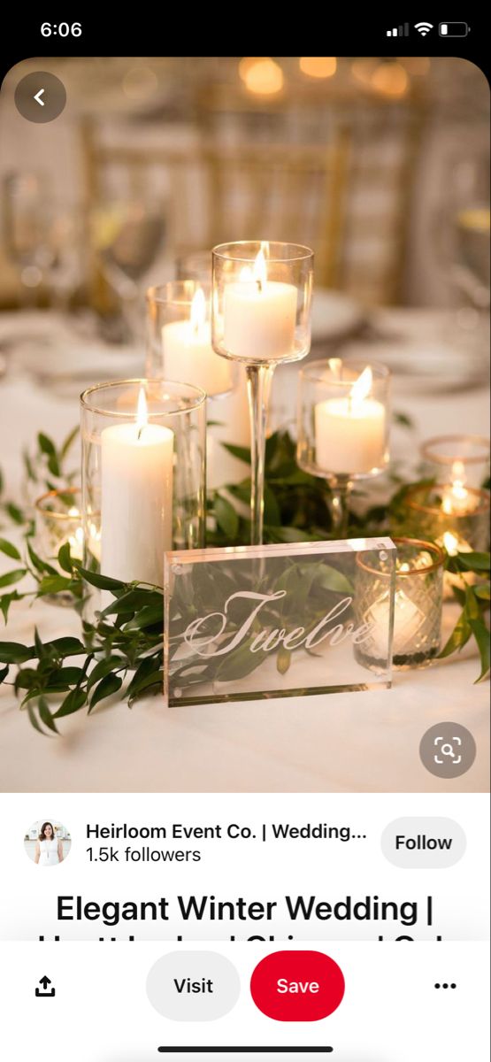 a table with candles and greenery on it for a wedding reception at hyatt lodge oak brook