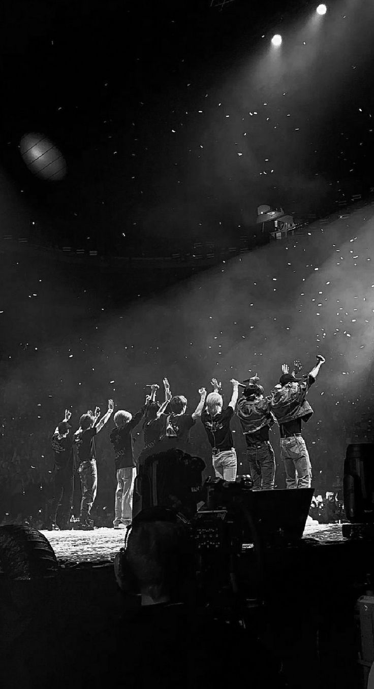 a group of people standing on top of a stage