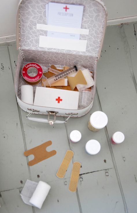 an open suitcase filled with medical supplies on the floor