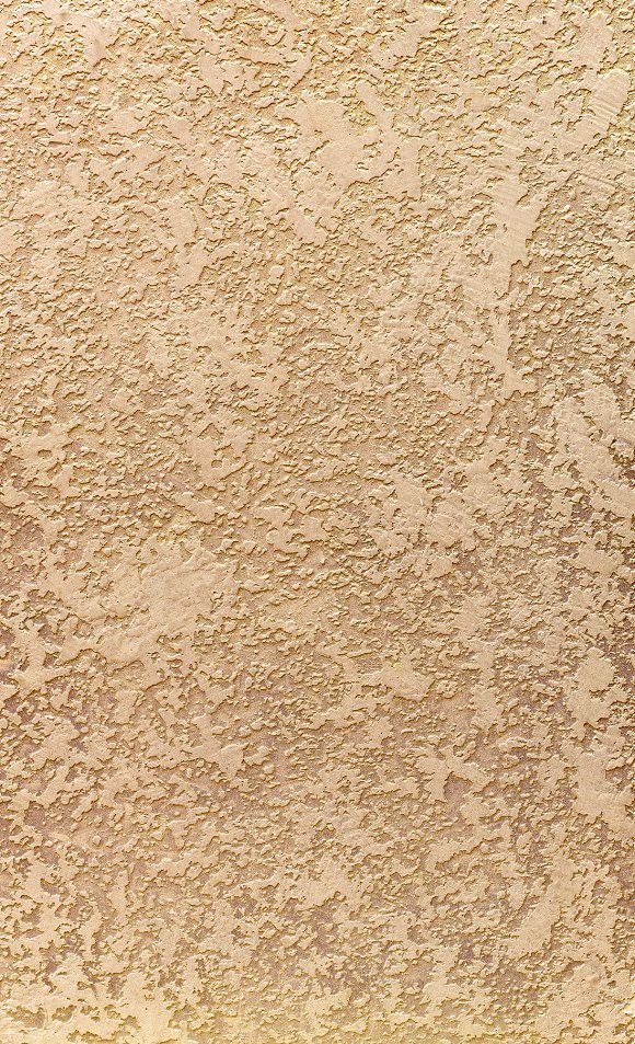 an orange and white surfboard sitting on top of a sandy beach