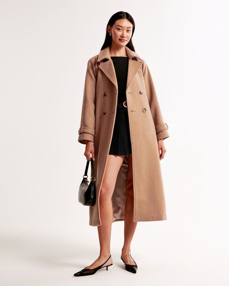 Our new on-trend trench coat in our heritage wool-blend fabric with an easy, relaxed-fit silhouette. This long-length cozy coat features classic trench details with double-breasted button closure and tie-front belt. Brown Wool Trench Coat, Winter Gabardine Wool Coat With Double Button Closure, Winter Brown Wool Coat With Double-breasted Buttons, Chic Brown Single-breasted Wool Coat, Tweed Shirt, Chic Brown Wool Coat With Double-breasted Button Fastening, Oversized Denim Shirt, Faux Leather Biker Jacket, Cozy Coats