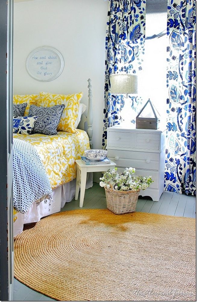 a bedroom with yellow and blue decor on the walls