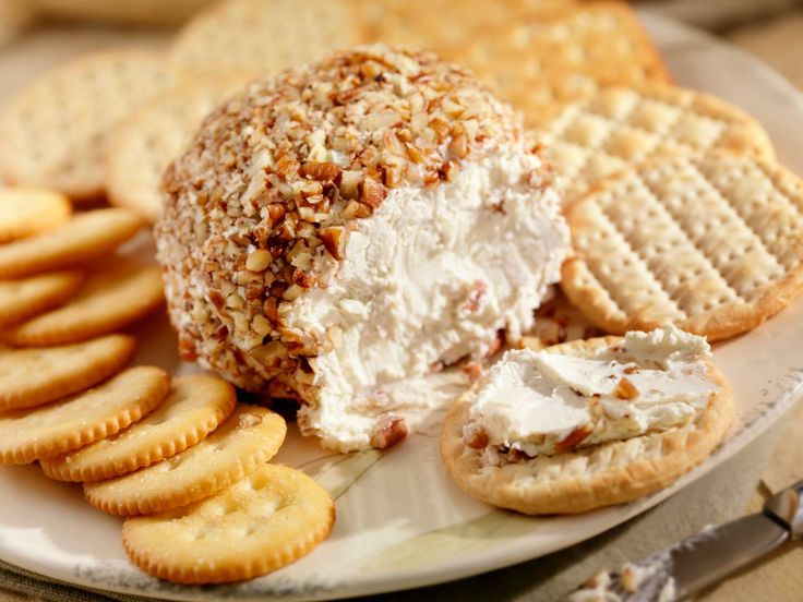 a plate with crackers and cheese on it