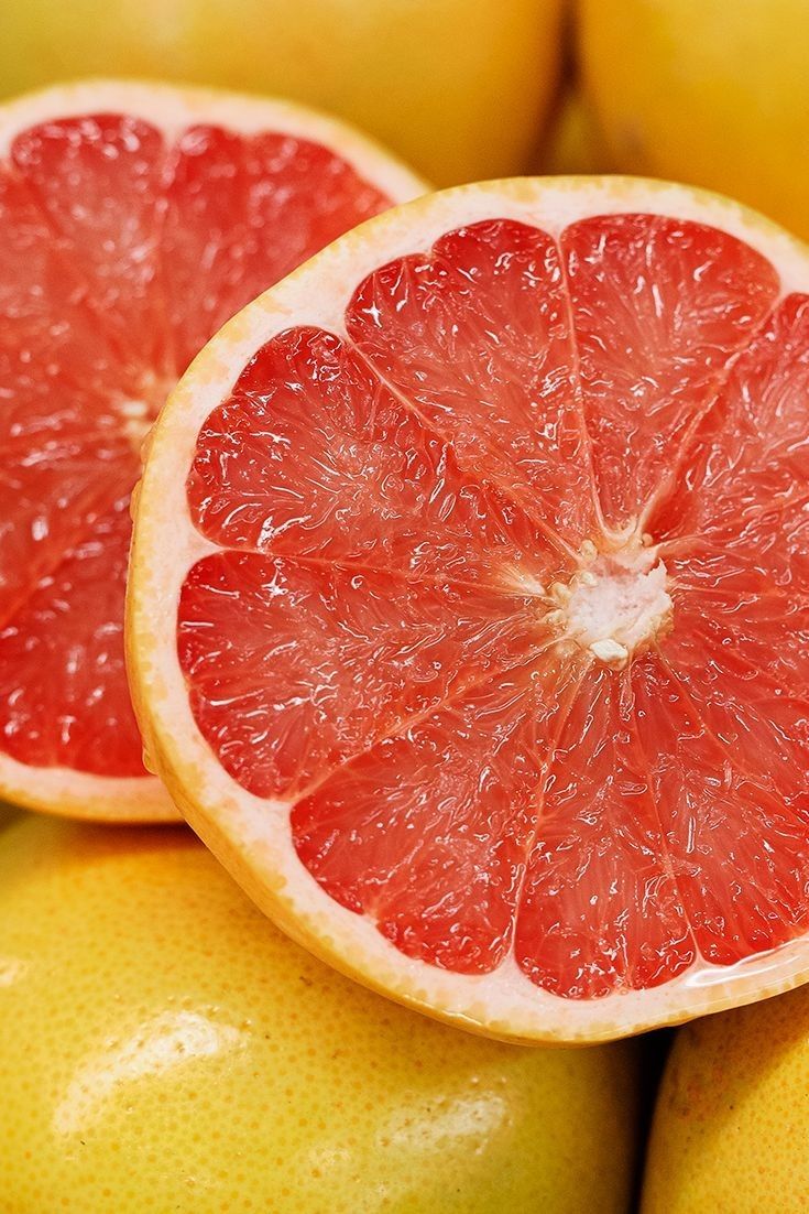 the grapefruit is cut in half and ready to be eaten