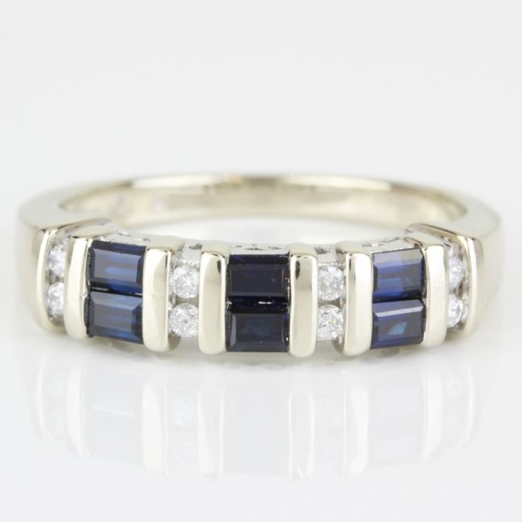 a white gold ring with sapphire and diamonds