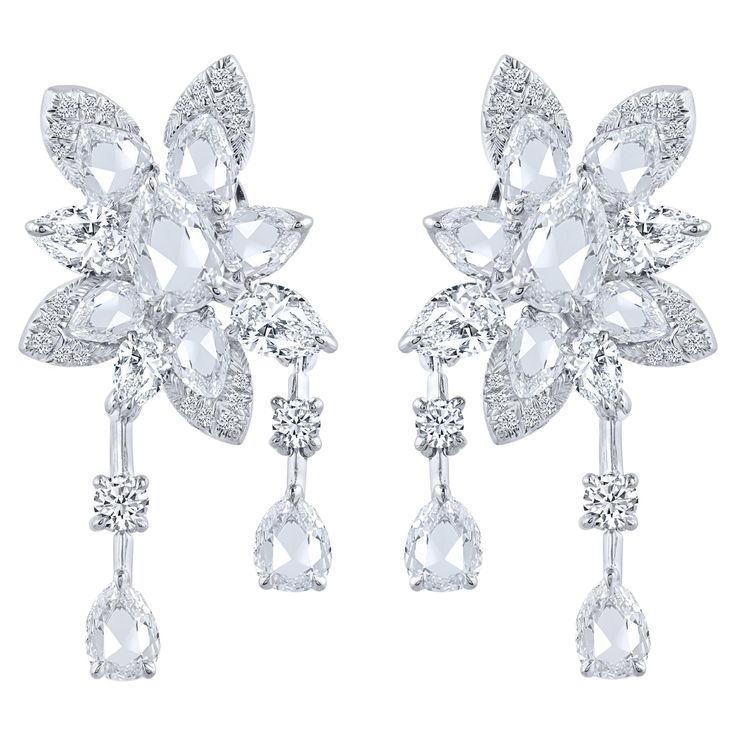 A beautiful arrangement of brilliant and rose cut diamonds come together to create these drop earrings which is a part of our Cascade collection. Studded with 44 round, 6 pear and 16 rose cut pear diamonds. Inspired by the beauty of the naturally flowing waterfall, these dangling earrings from our Cascade Collection are crafted in 18 KT white gold and can be secured comfortably with omega and guardian post. Drawing from a century of expertise in the diamond and jewelry industry, HARAKH was launc Art Jewelry Design, Colorless Diamond, Pear Diamond, Dangling Earrings, Rose Cut Diamond, Rose Cut, Luxury Jewelry, Jewelry Art, Precious Stones