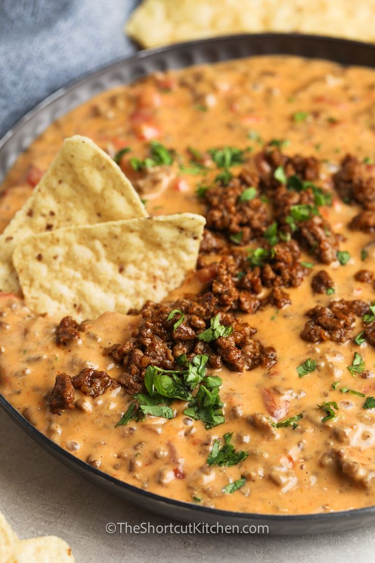 a bowl filled with chili and tortilla chips